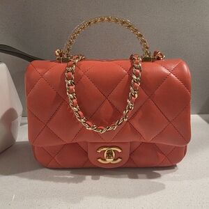 Chane rectangular flap bag in a red/coral lambskin leather with gold-tone hardwa